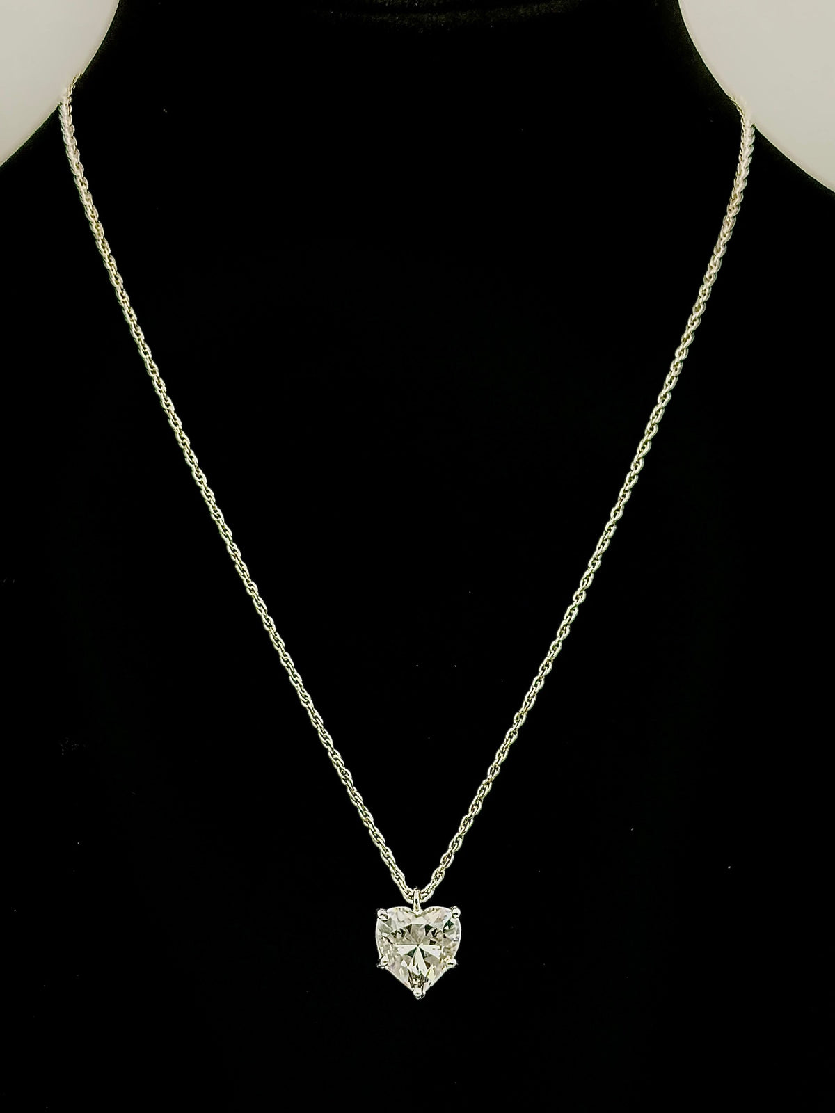 16" silver tone chain with heart shaped clear gem pendant